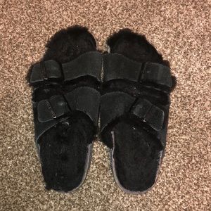 Black, fuzzy Birkenstock’s size 37